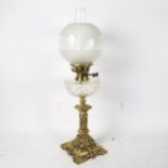 A Victorian cast and pierced brass oil lamp, with cut-glass font, chimney and shade, 68cm