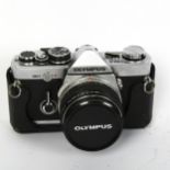 OLYMPUS - a Vintage OM-2 35mm single lens reflex camera, with Olympus 1:1,8 F=50MM lens, serial