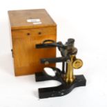 A Vintage brass-mounted student's microscope, by Bausch & Lomb, New York, cased, height 16cm