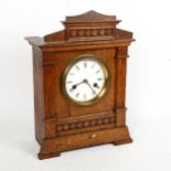 An early 20th century Hamburg American Clock Co oak 8-day mantel clock, 14-day strike, case height