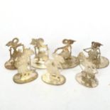 A set of 7 Eastern white metal figural place name holders, height 5cm