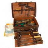 A leather-cased set of piano tuning tools, including wrenches