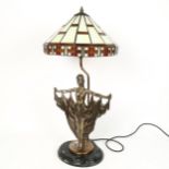 A reproduction Tiffany style leadlight figural table lamp, with resin sculpture base, overall height