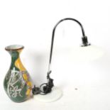 A table lamp with white glass shade, and an Art pottery vase with mythical beast design, 31cm