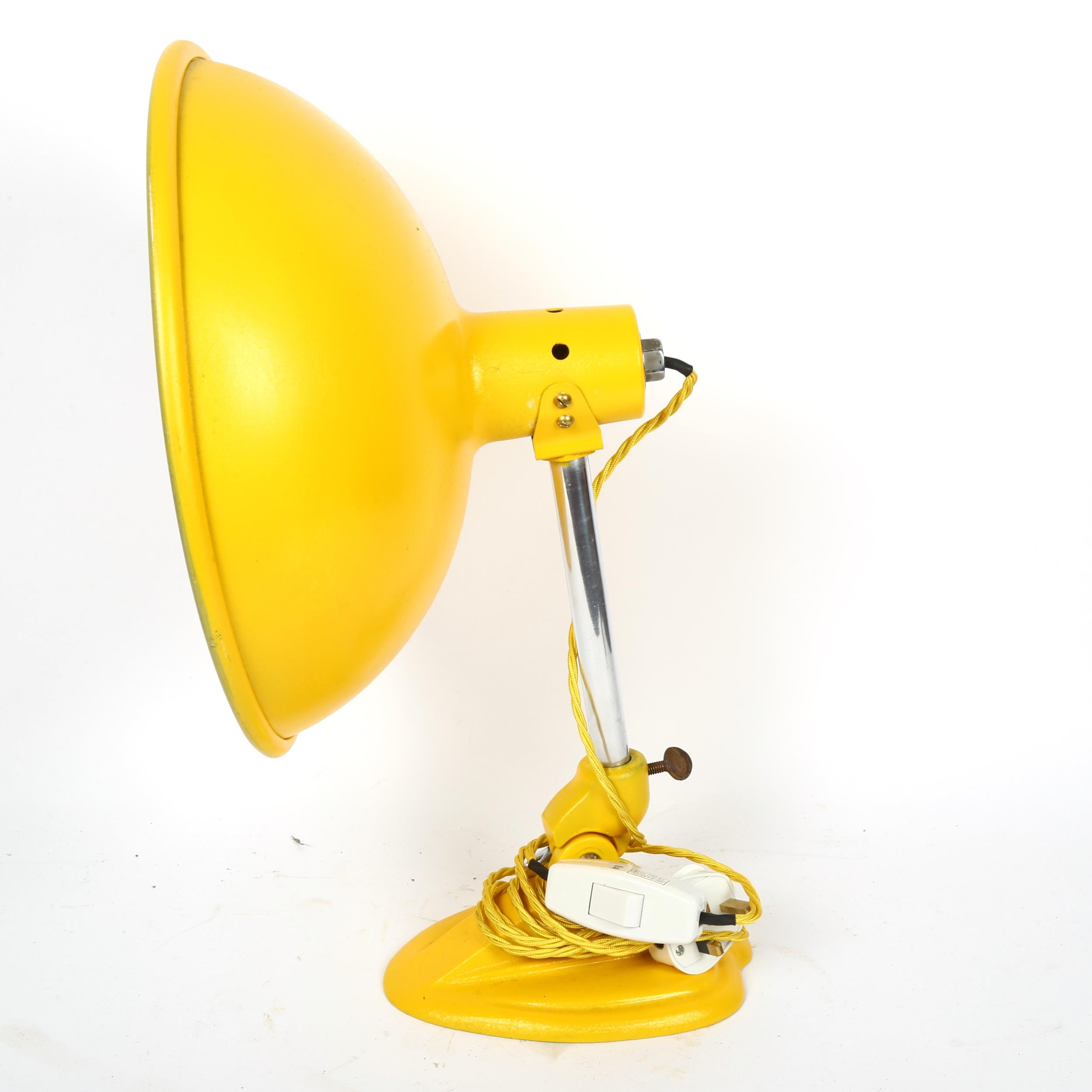 A mid-century yellow aluminium Ergon desk lamp, shade diameter 33cm