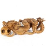 A Chinese carved hardwood dragon and pearl figure, length 48cm