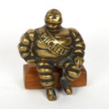 A Vintage cast-brass Michelin Man motorcar mascot, height 10cm