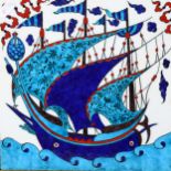 An enamelled tile depicting a sailing ship at sea, framed, height 39cm