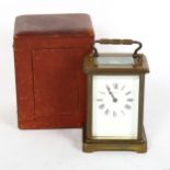 A brass-cased carriage clock, by Dobell Brothers of Hastings, height 11cm, in red leather travelling