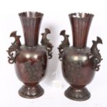 A pair of Japanese Meiji Period bronze vases, unsigned, height 27cm Bases have a few minor dents,