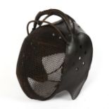 A 19th century Italian iron and leather fencing mask, no maker's marks