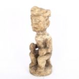 An African Tribal soapstone fertility figure, height 25cm No damage or restoration