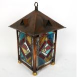 A reproduction copper and stained glass lantern desk lamp, height 45cm, width 28cm No chips cracks