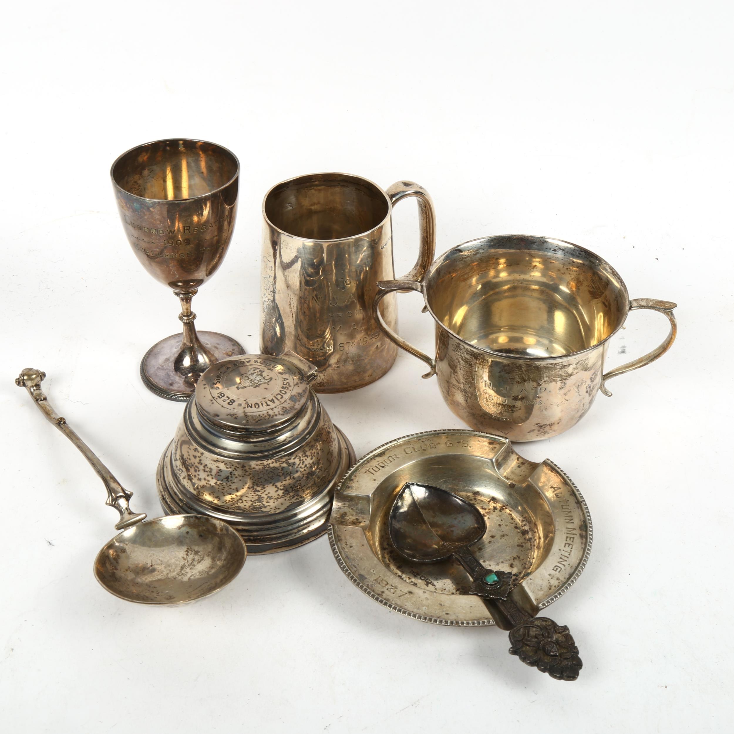 A group of silver presentation pieces, to include christening mug, a 2-handled sugar bowl, an