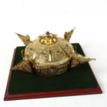 A Tibetan jewelled brass ornamental crown, internal diameter 16.5cm, in display stand