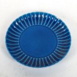A Chinese blue ground dish, with scalloped rim and 4 character mark, 15cm