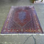 A large blue and red ground Persian carpet, 340cm x 250cm (Viewing by appointment only for this