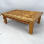 A reclaimed pine rectangular coffee table, with relief carved panelled top, 120cm x 20cm x 81cm