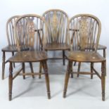 A set of 7 oak wheel-back dining chairs (6 and 1)