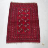 A red ground Afghan rug, 122cm x 90cm