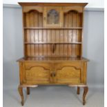 An Antique oak Arts and Crafts 2-section dresser, the top section with single leadlight glazed