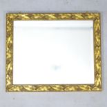 A small composite gilded wall mirror, 59cm x 49cm