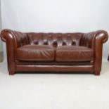 A contemporary studded brown leather button-back Chesterfield style 2-seater sofa, L165cm