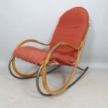 A mid-century bentwood rocking chair on metal frame