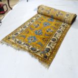 A yellow and cream ground Persian runner, 488cm x 82cm