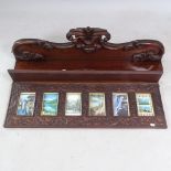 An Antique carved mahogany picture frame, 93cm x 42cm x 13cm, and a mahogany hanging shelf, with