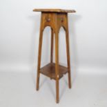 An Arts and Crafts oak 2-tier jardiniere stand, 30cm x 92cm