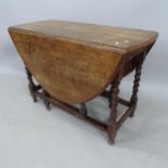 An oak oval gateleg table, 98cm x 73cm x 50cm