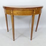 A 19th century satinwood-banded fold over tea table, with marquetry decoration, raised on square