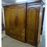 A large and impressive Victorian mahogany break-front wardrobe, with central fitted linen press,