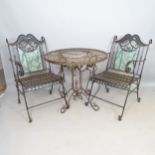 A pair of wrought-iron folding garden chairs, and a similar wrought-iron circular-top garden