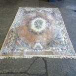 A large Chinese style pink ground carpet, with floral embossed pattern, 370cm x 270cm (Viewing by