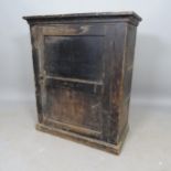 An early 20th century stained pine hall cabinet, with single panelled door and 2 fitted shelves,