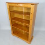 A modern pine open bookcase, with 3 adjustable shelves, 83cm x 123cm x 30cm