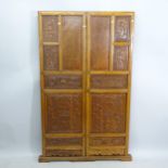 A Chinese elm 2-section screen, with relief and applied carved panels, 105cm x 175cm