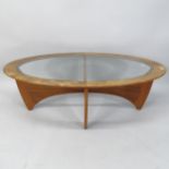 A mid-century G Plan teak oval coffee table, with inset glass top, 122cm x 42cm x 66cm