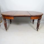 A William IV oval draw leaf mahogany dining table, with 3 spare leaves, maximum 237cm x 73cm x 120cm