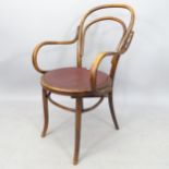 An Antique bentwood desk chair with studded seat