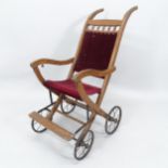 A Victorian wooden-framed folding push chair