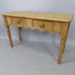 A pine console table, with 2 frieze drawers on baluster turned legs, 120cm x 77cm x 40cm