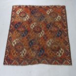 A red ground Tekki rug, 145cm x 134cm