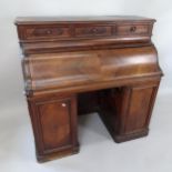A 19th century French walnut cylinder-front pedestal writing desk, with sliding interior, 122cm x