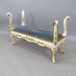 An early 20th century painted and gilded stool of unusual design, with upholstered seat, 95cm x 62cm