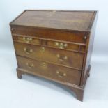 A 19th century oak bureau, with well fitted interior and 2 short and 2 long drawers below, on