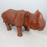 A carved wooden sculpture of a rhino, L110cm