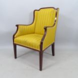 An Edwardian mahogany and chequered-banded upholstered armchair